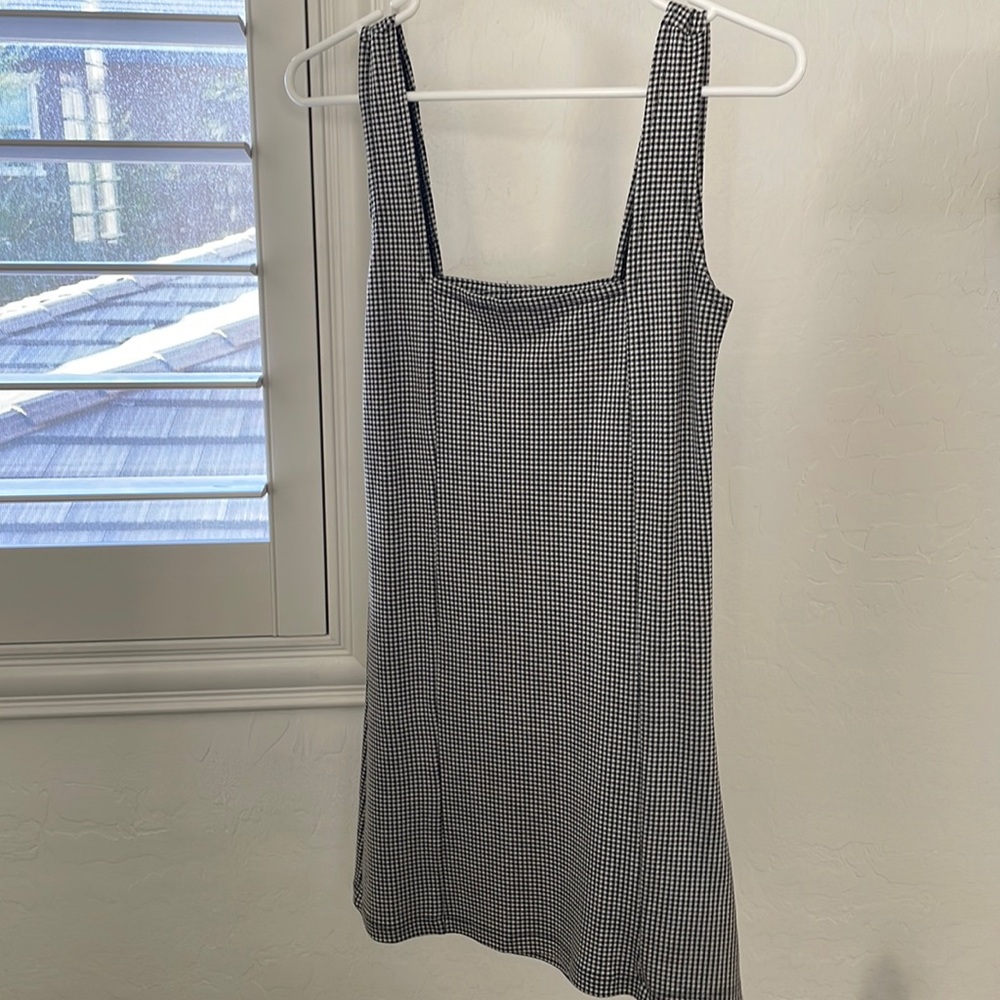 Stripped tight dress with broach buckle details